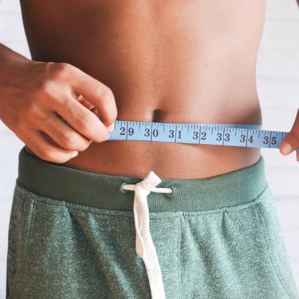 Man measuring his waist